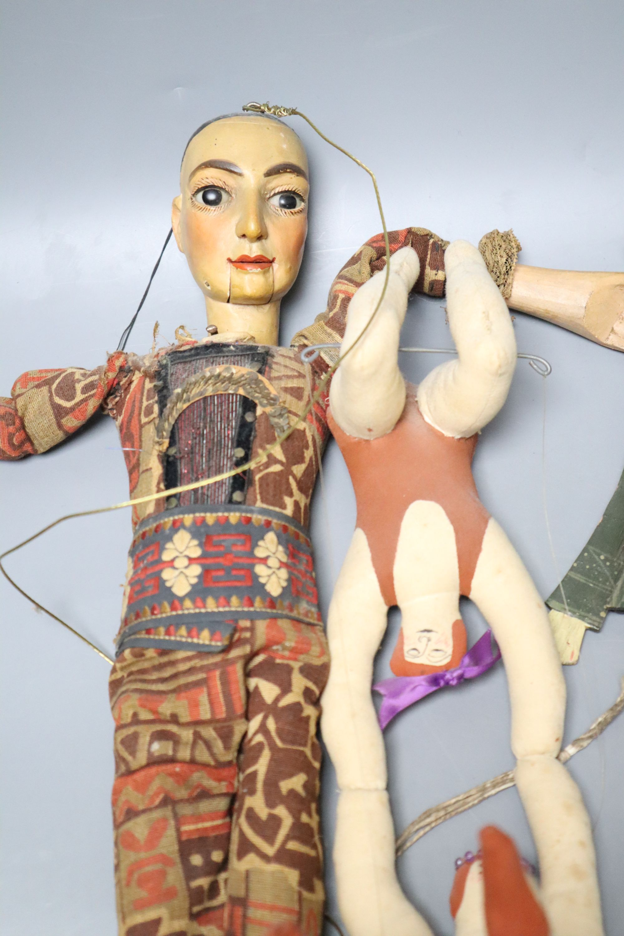 A Spanish / South American articulated marionette and two other toys